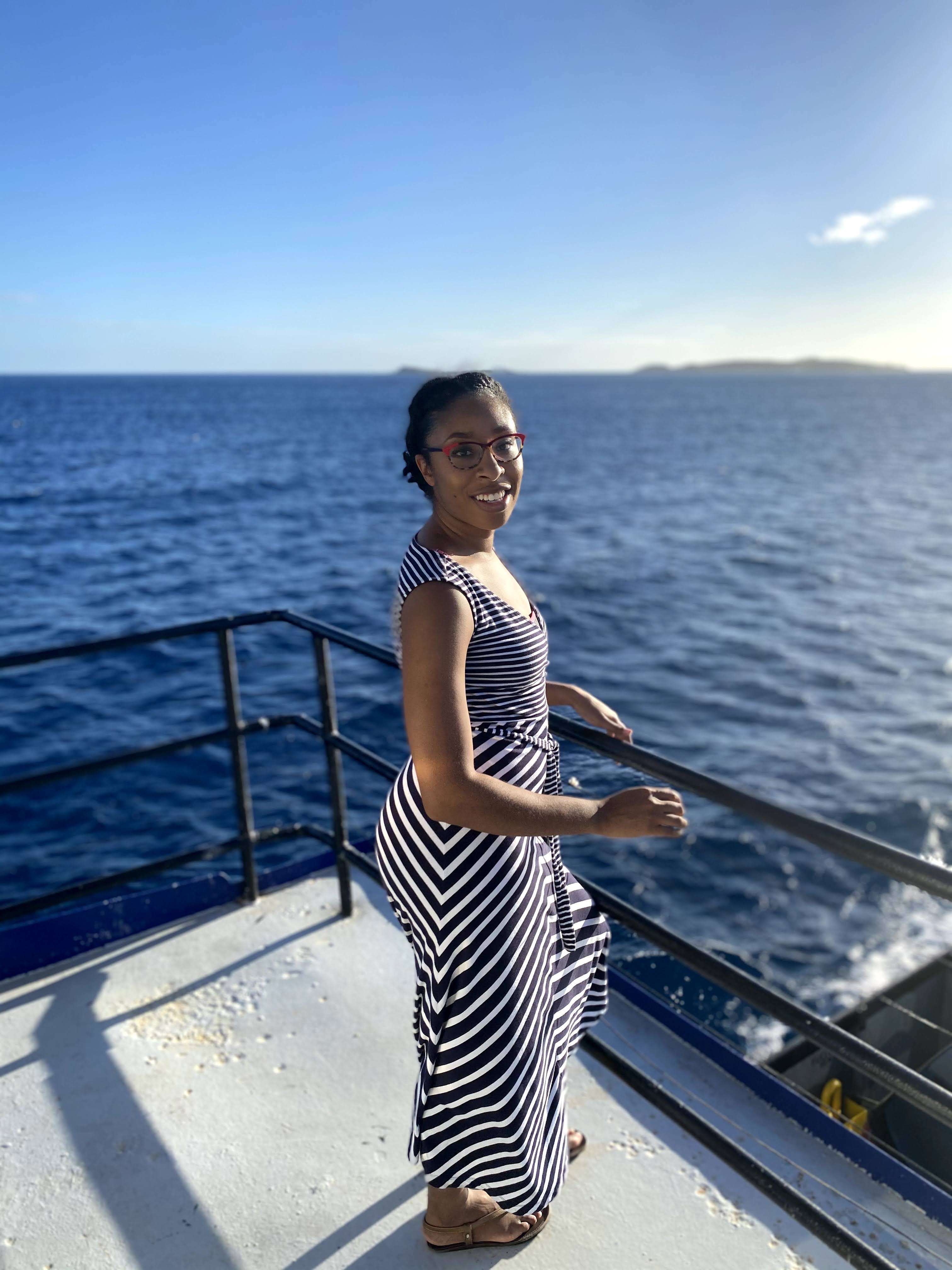 Dr. Britney Scott on a boat heading to the beach